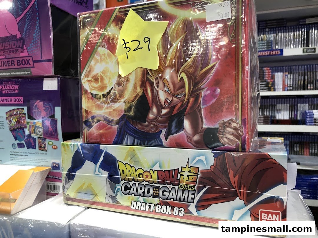 Close-up of Dragon Ball Super Card Game products and other trading card game boxes on display.