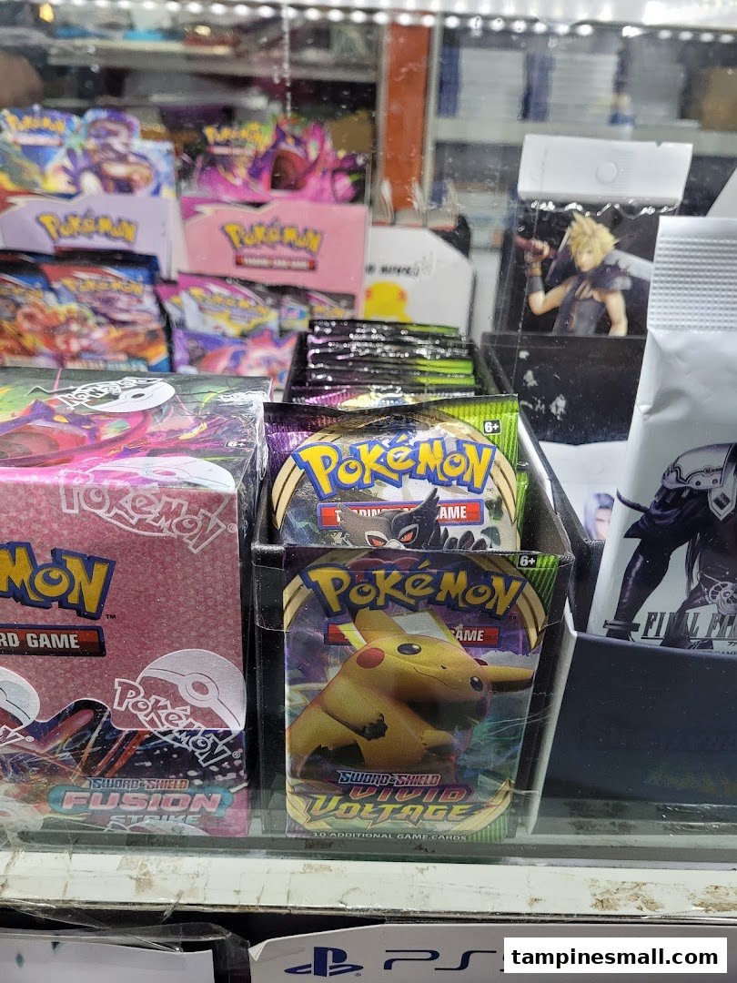 A display case showcasing various Pokémon trading card game products and other gaming merchandise.