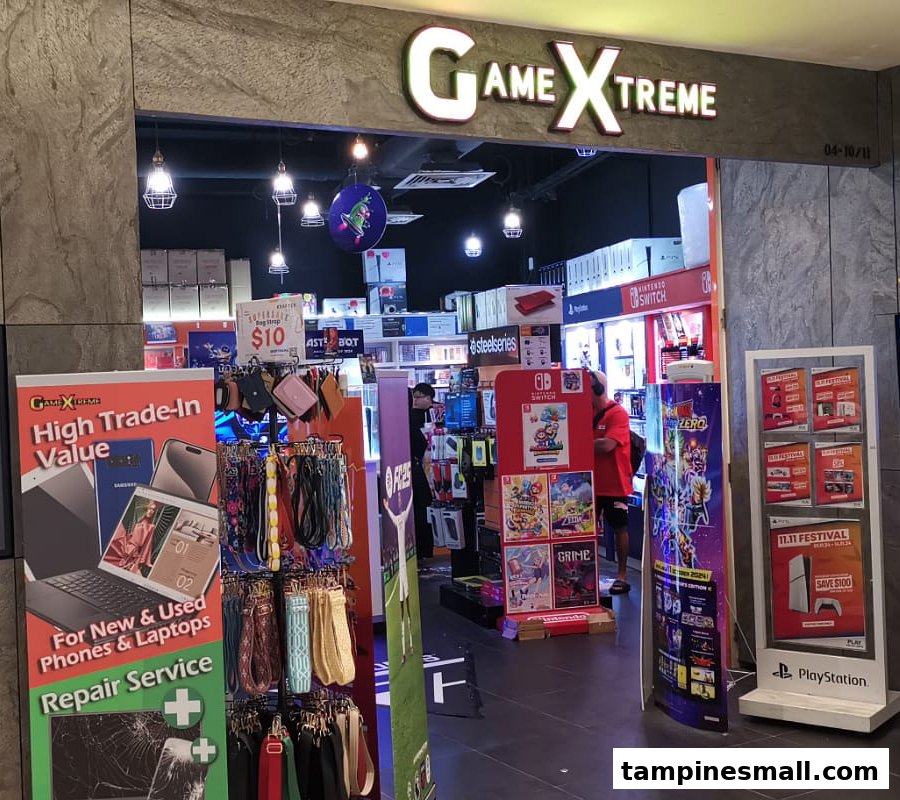 The storefront of GameXtreme, a gaming and electronics shop, featuring promotional displays and interior view.