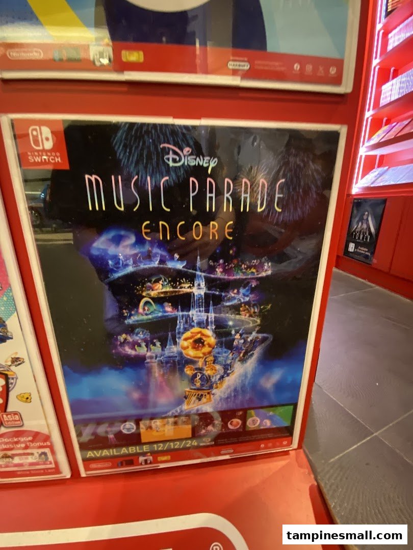A vibrant poster for Disney Music Parade Encore on Nintendo Switch displayed in a game store.