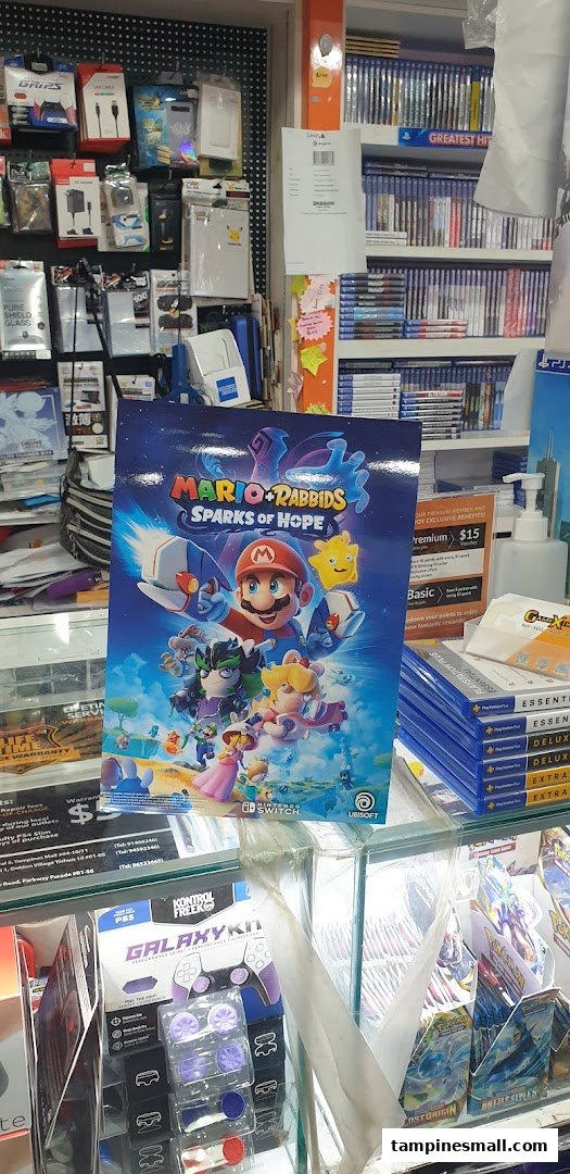 An interior shot of GameXtreme Tampines, featuring video games, accessories, and a prominent Mario + Rabbids display.