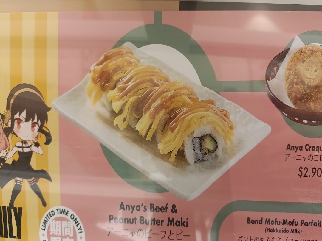 A menu display featuring special collaboration items like Anya's Beef & Peanut Butter Maki and Anya Croque.