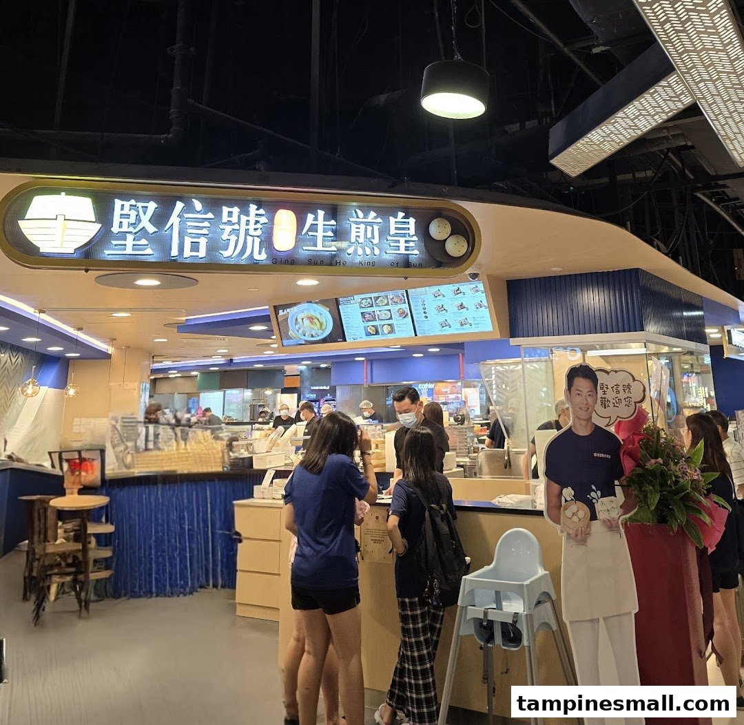 Customers at a bustling food stall named Ging Sun Ho King of Bun.