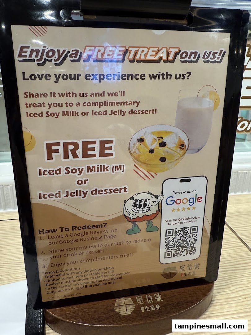 A promotional sign offering free iced soy milk or jelly dessert for Google reviews.