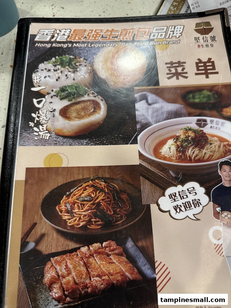 A menu page showcasing Hong Kong's legendary pan-fried buns, noodles, and grilled meat.