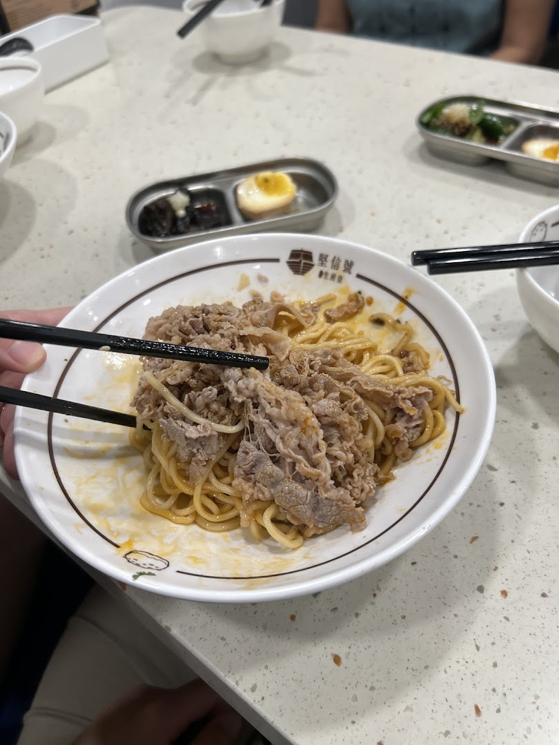 A close-up of delicious beef noodles being enjoyed at Ging Sun Ho King of Bun.