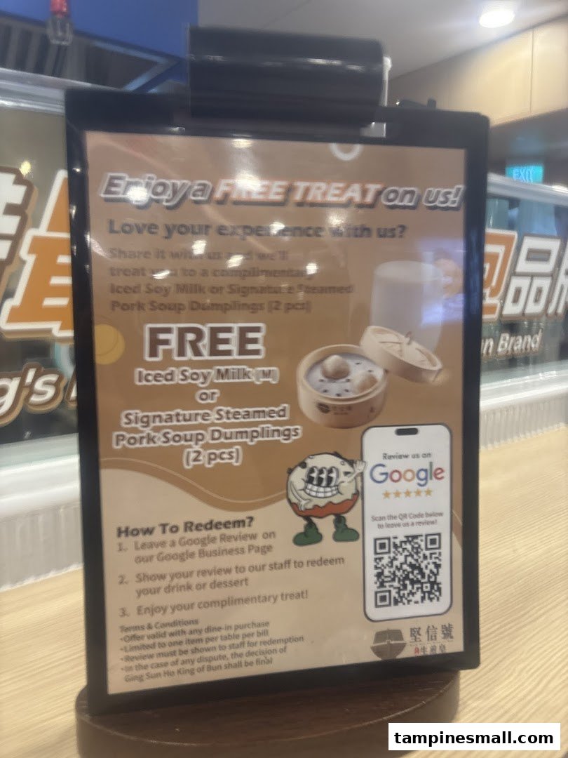 A promotional sign from Ging Sun Ho King of Bun offering a free treat for leaving a Google review.