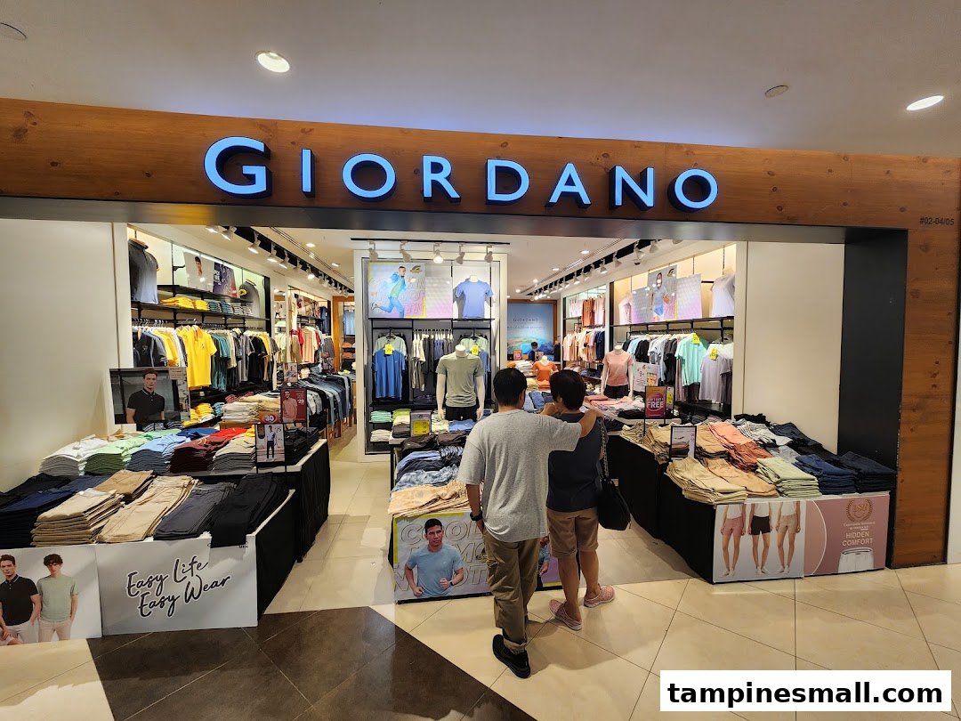 The inviting entrance of a Giordano clothing store, showcasing a wide range of casual wear and apparel.