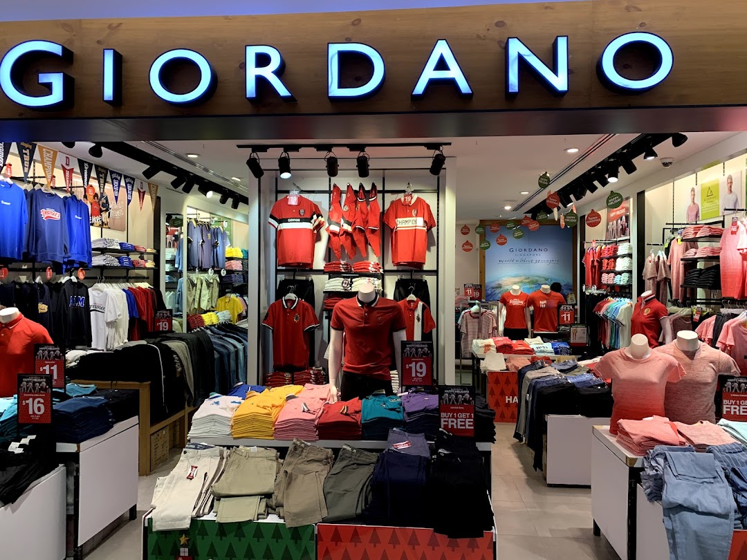 The Giordano shop entrance showcases a wide selection of casual apparel and holiday decorations.