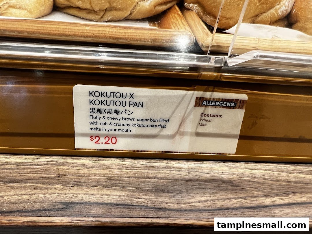 Close-up of a Kokutou Pan product label with description, price, and allergen information.