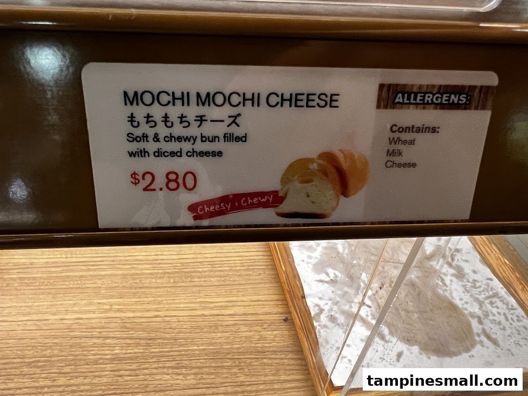 Close-up of a Mochi Mochi Cheese bun label with price and allergen details.