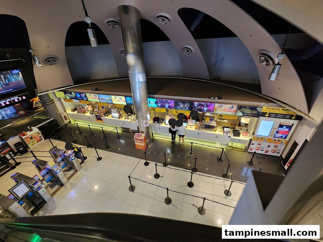 Overhead view of Golden Village Tampines cinema lobby with ticketing and concession counters.