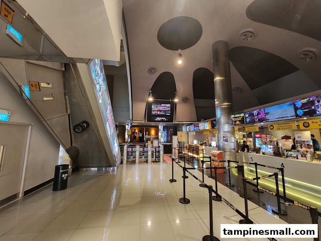 Interior view of Golden Village Tampines cinema lobby with concession stands and ticket counters.