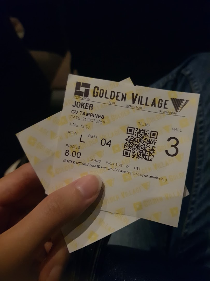 A hand holding a Golden Village movie ticket for 'Joker' at GV Tampines.