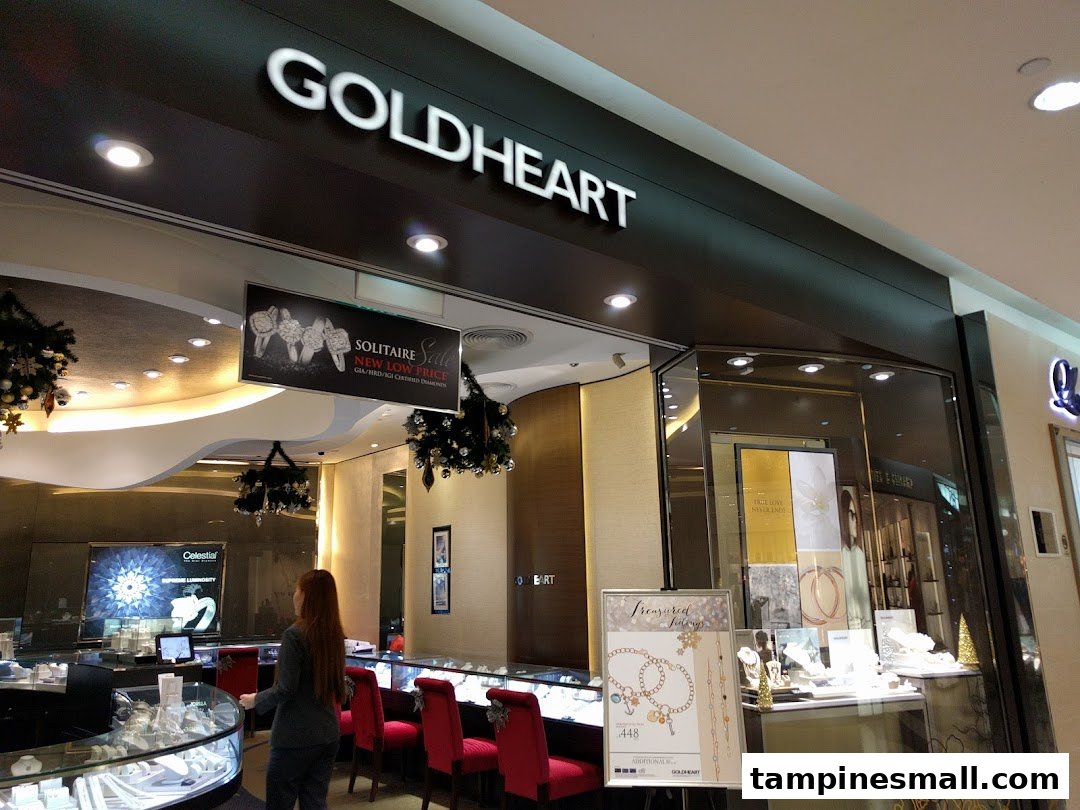 Goldheart Jewelry shop entrance with sparkling displays, a customer, and festive decorations.