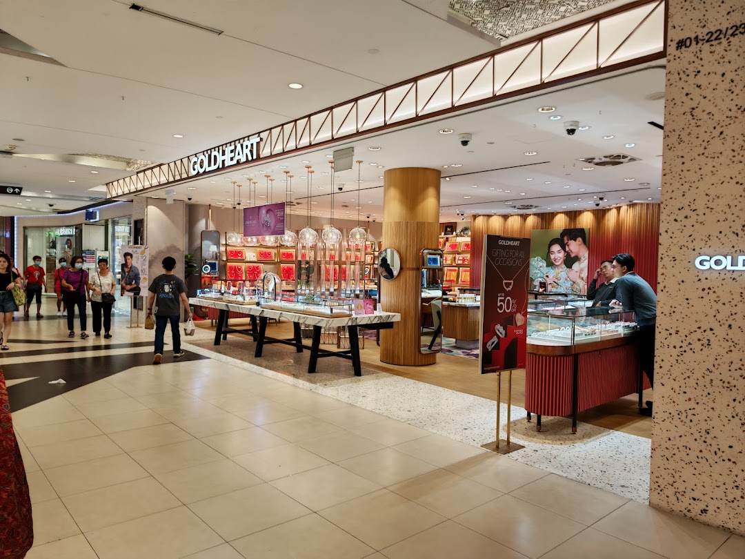 The Goldheart Jewelry shop entrance in Tampines Mall, showcasing elegant displays and inviting customers.