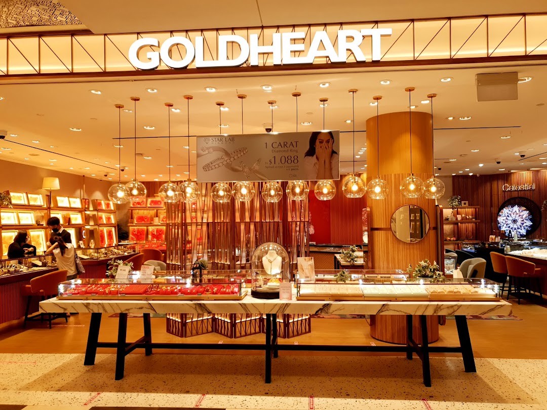 Brightly lit Goldheart Jewelry shop entrance showcasing elegant displays and sparkling collections.