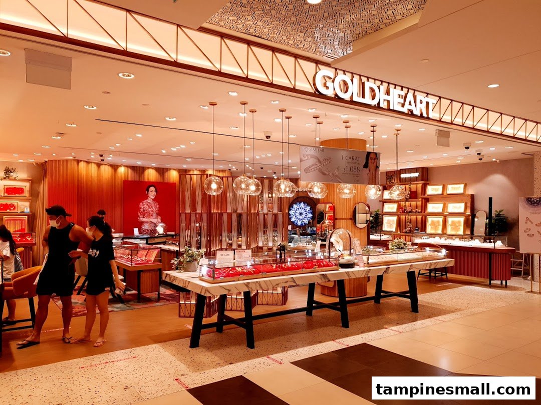 The brightly lit interior of Goldheart Jewelry, showcasing elegant displays and customers browsing.