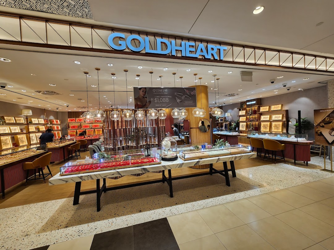 The brightly lit entrance and interior of Goldheart Jewelry, showcasing elegant display cases and sparkling collections.