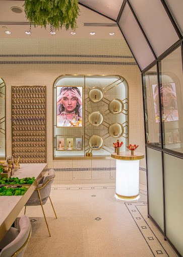 Elegant interior of GRATiAE Isetan Tampines Mall, showcasing luxury skincare products and sophisticated displays.