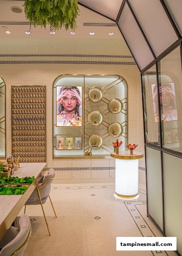 Elegant interior of GRATiAE Isetan Tampines Mall, showcasing luxury skincare products and sophisticated displays.