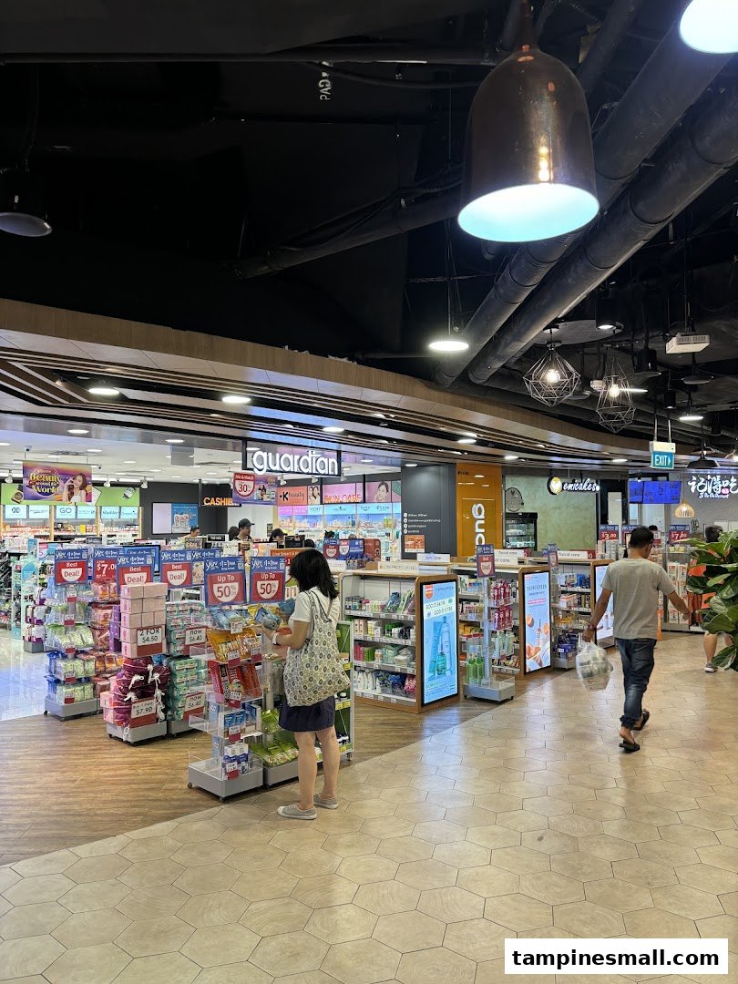 An interior view of Guardian Health & Beauty, showcasing various health and beauty products with customers browsing.