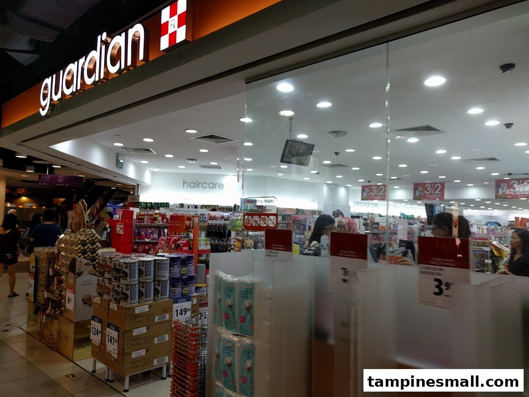 The brightly lit entrance of Guardian Health & Beauty Pharmacy, showcasing a wide range of products and promotions.