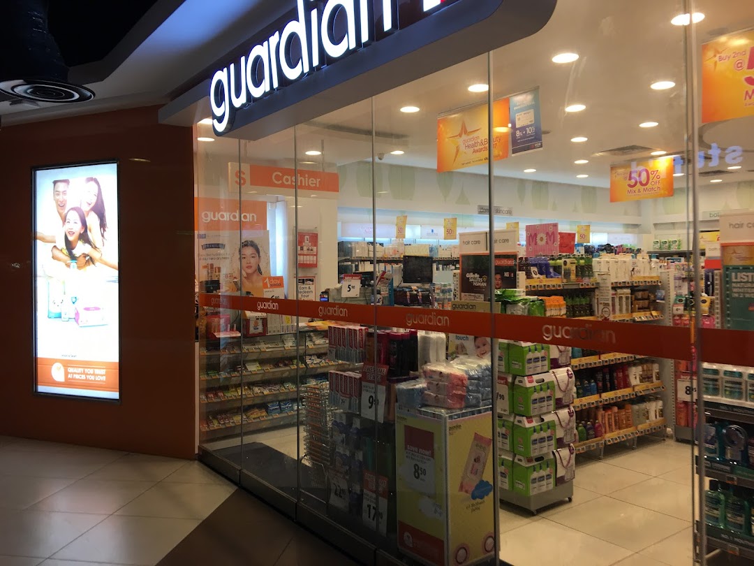 The brightly lit entrance of Guardian Health & Beauty Pharmacy, showcasing its wide range of products.