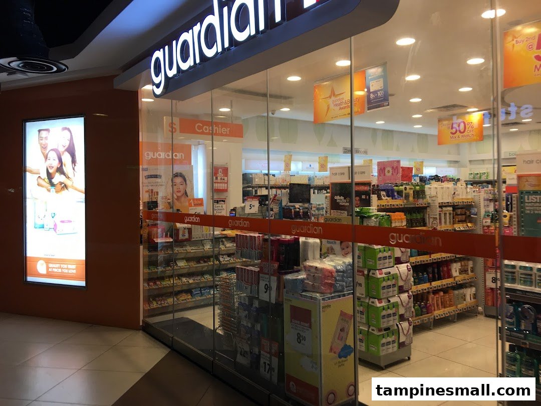The brightly lit entrance of Guardian Health & Beauty Pharmacy, showcasing its wide range of products.