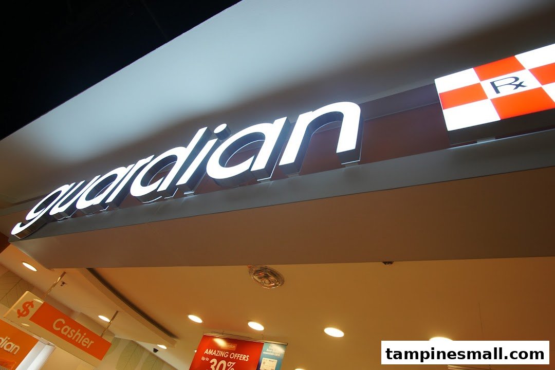 Illuminated Guardian sign above the entrance of a health and beauty pharmacy.