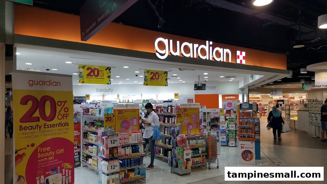 The entrance of Guardian Health & Beauty Pharmacy with promotional displays and customers inside.