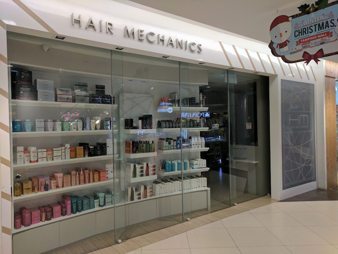 The storefront of Hair Mechanics, showcasing a wide array of hair care products in its display windows.
