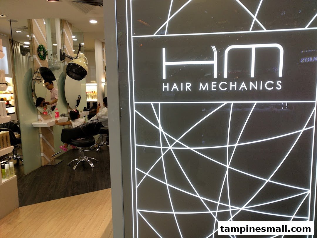 Interior view of Hair Mechanics salon showing a stylist attending to a child's hair.