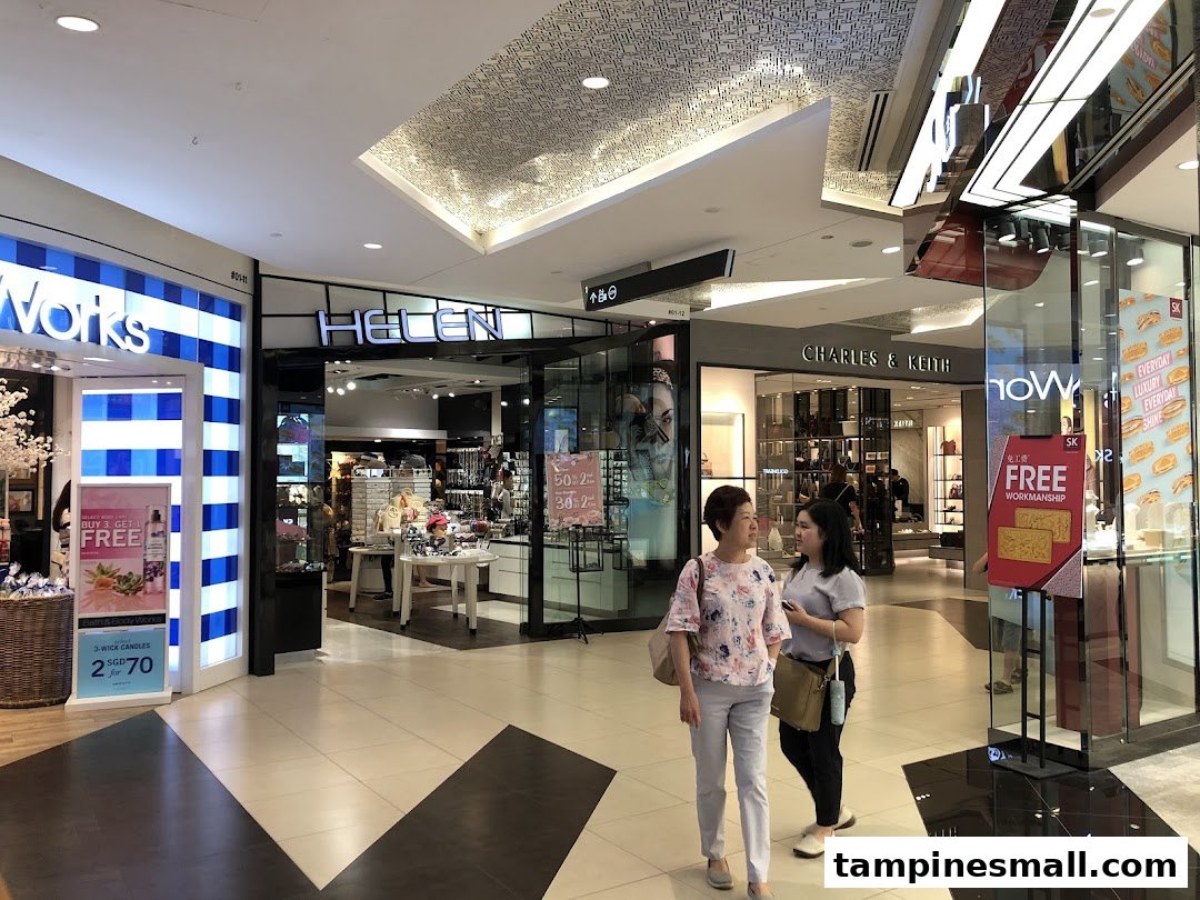 Exterior view of Helen Tampines Mall entrance, showcasing accessories and gifts in a vibrant mall setting.