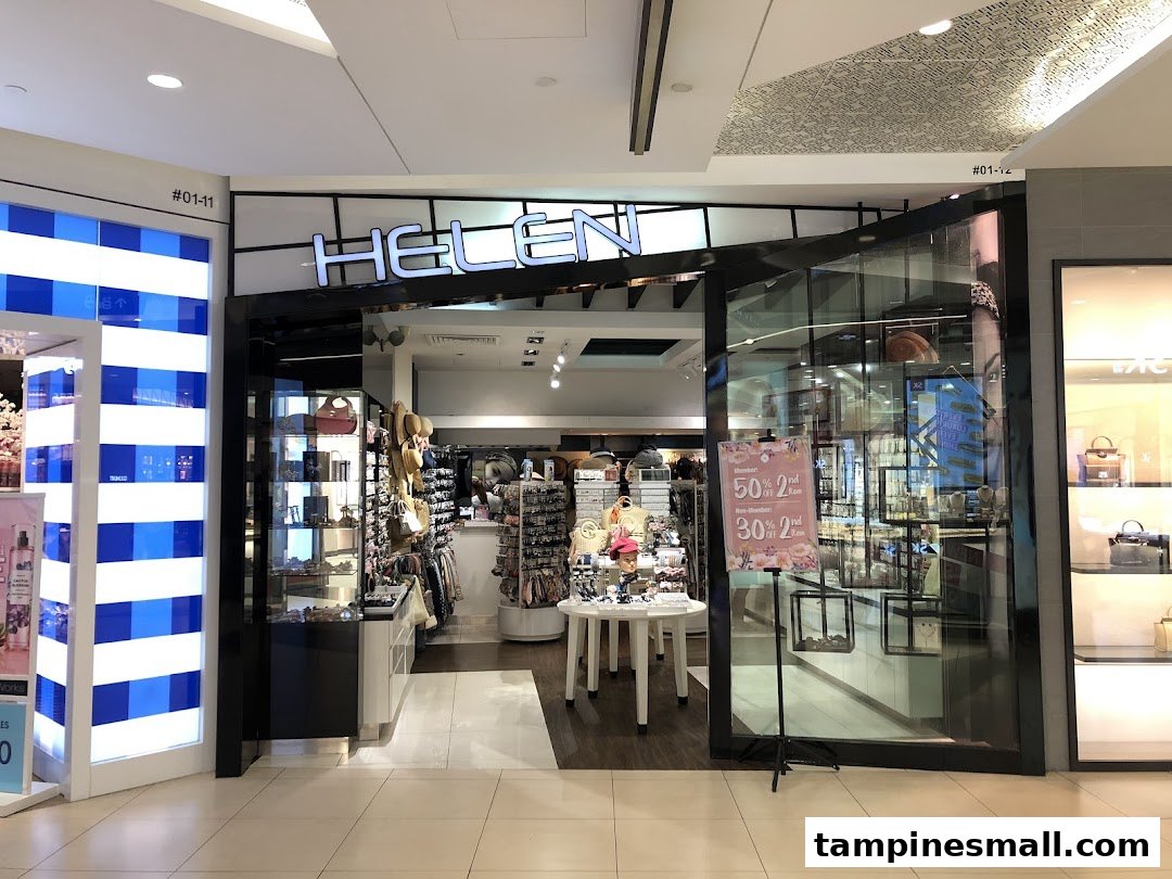 The Helen shop entrance at Tampines Mall, showcasing a wide array of fashion accessories and a sale sign.