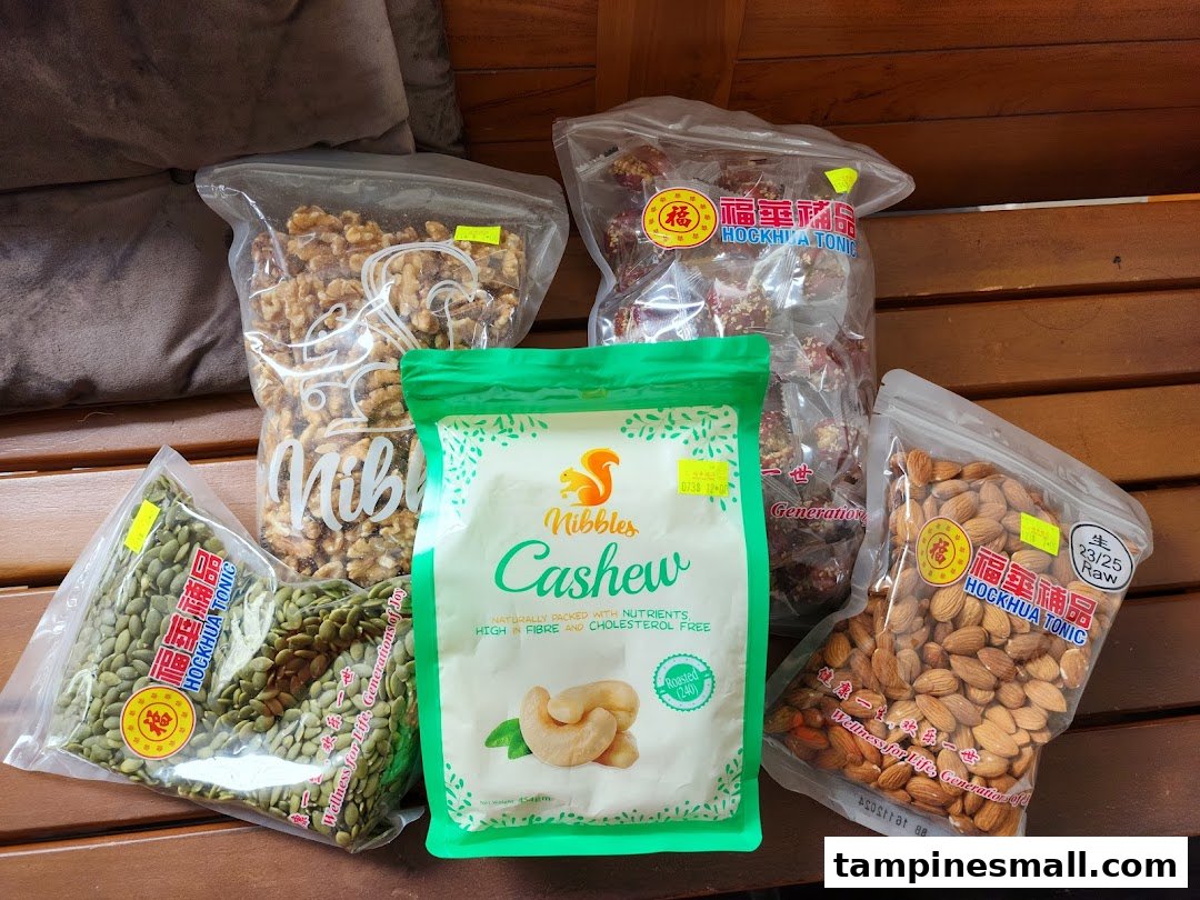 A variety of packaged nuts and seeds, including cashews, walnuts, almonds, and pumpkin seeds.