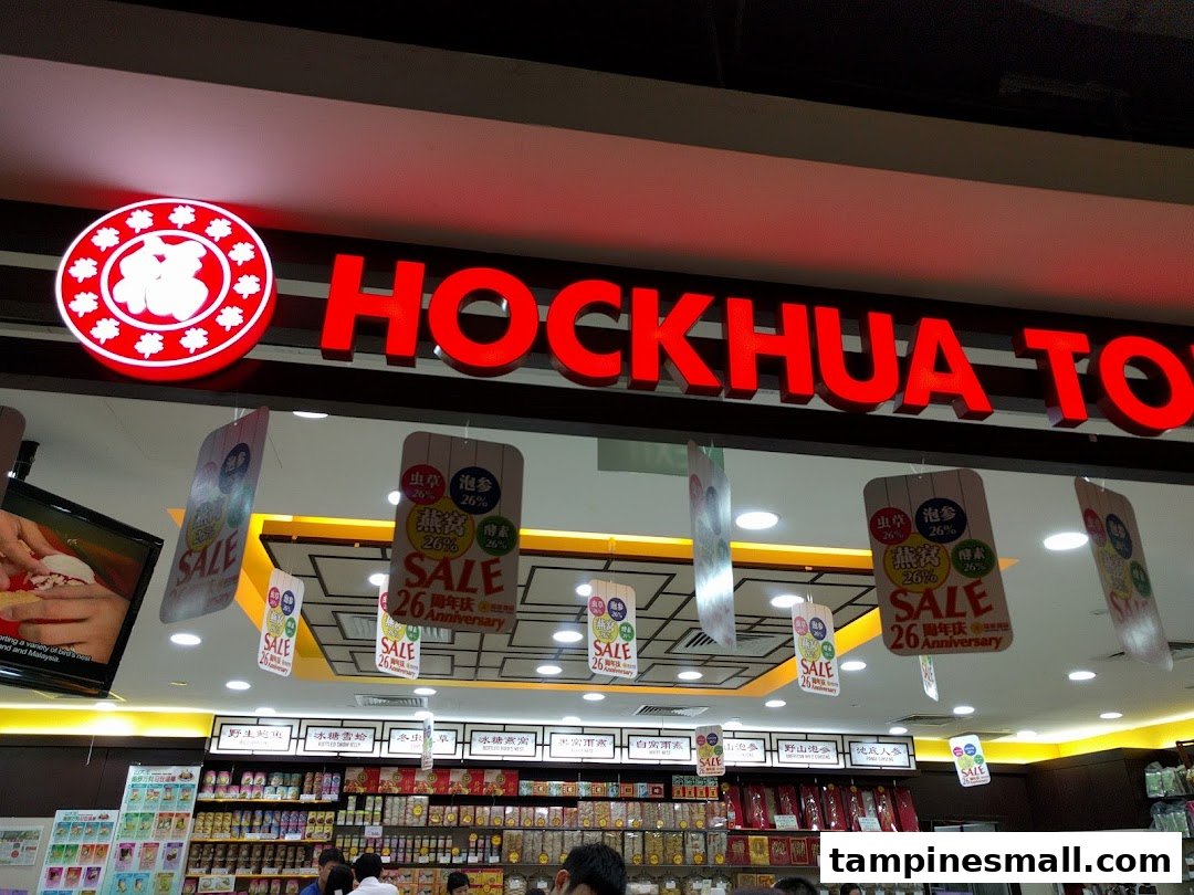 The illuminated Hockhua Tonic shop sign above its entrance, showcasing health products and anniversary sale banners.