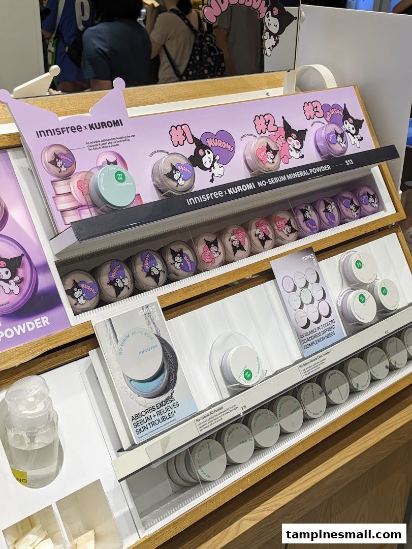 A display of Innisfree x Kuromi collaboration makeup and skincare products, including mineral powders and AC powder.