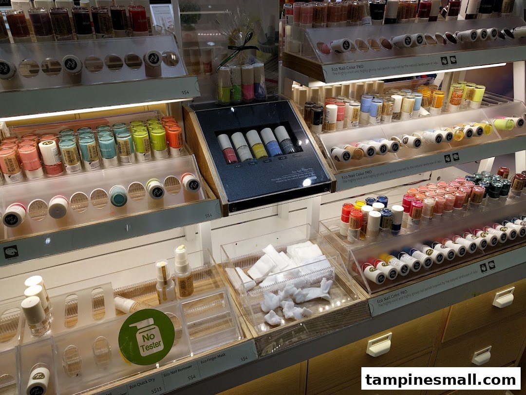 A vibrant display of Innisfree's Eco Nail Color PRO polishes and nail care products in a retail setting.