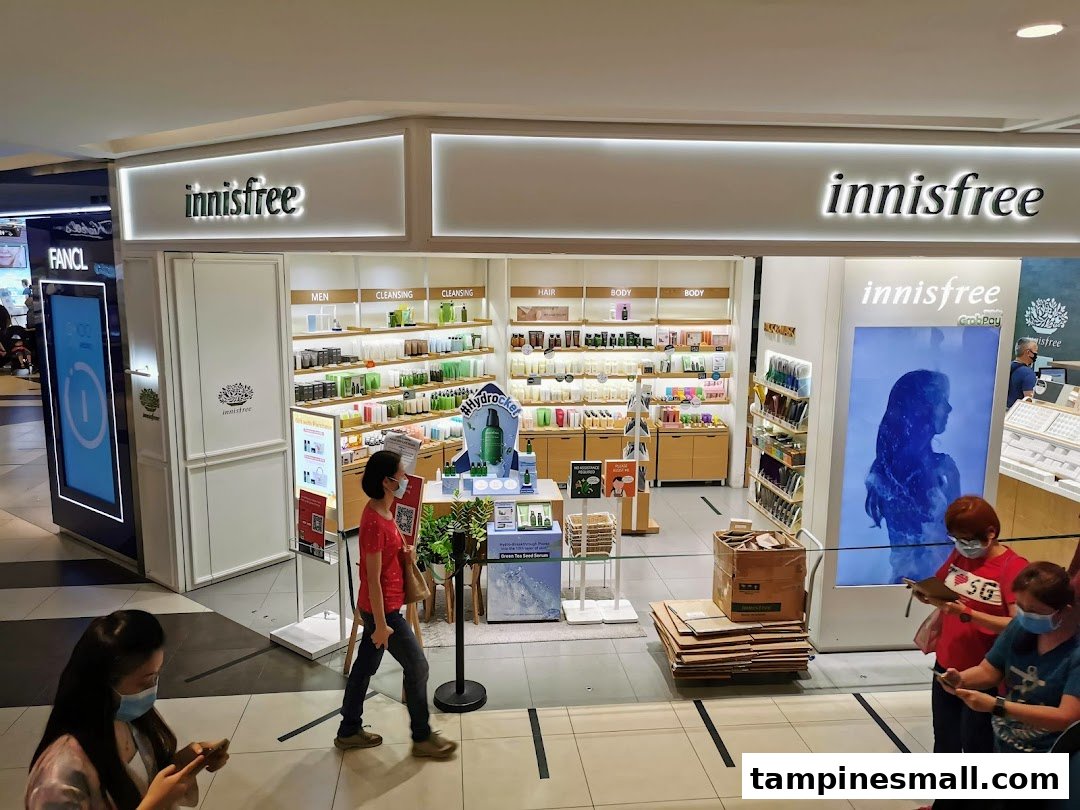 The Innisfree shop entrance at Tampines Mall, showcasing its natural beauty products and inviting interior.