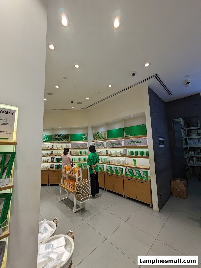 Two customers browse skincare products displayed on shelves in a brightly lit Innisfree store.