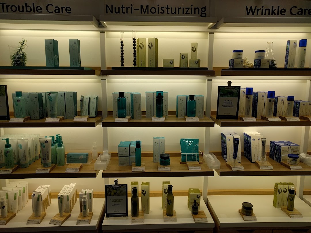 Well-lit shelves displaying a variety of Innisfree skincare products categorized by skin concern.