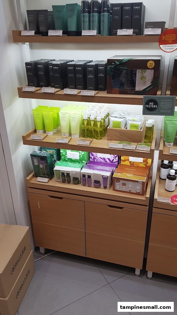 Innisfree skincare products, including Forest for Men and Apple Seed lines, displayed on wooden shelves.