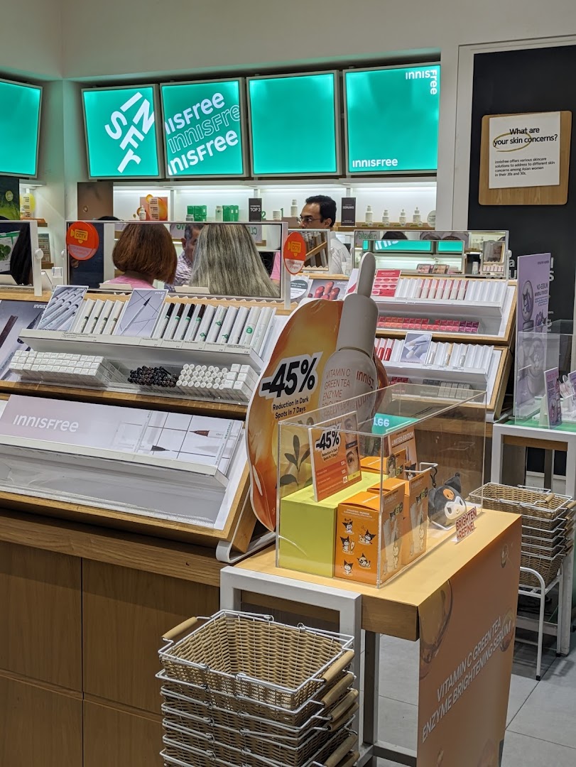 Interior view of Innisfree showcasing skincare product displays, promotions, and brand signage.