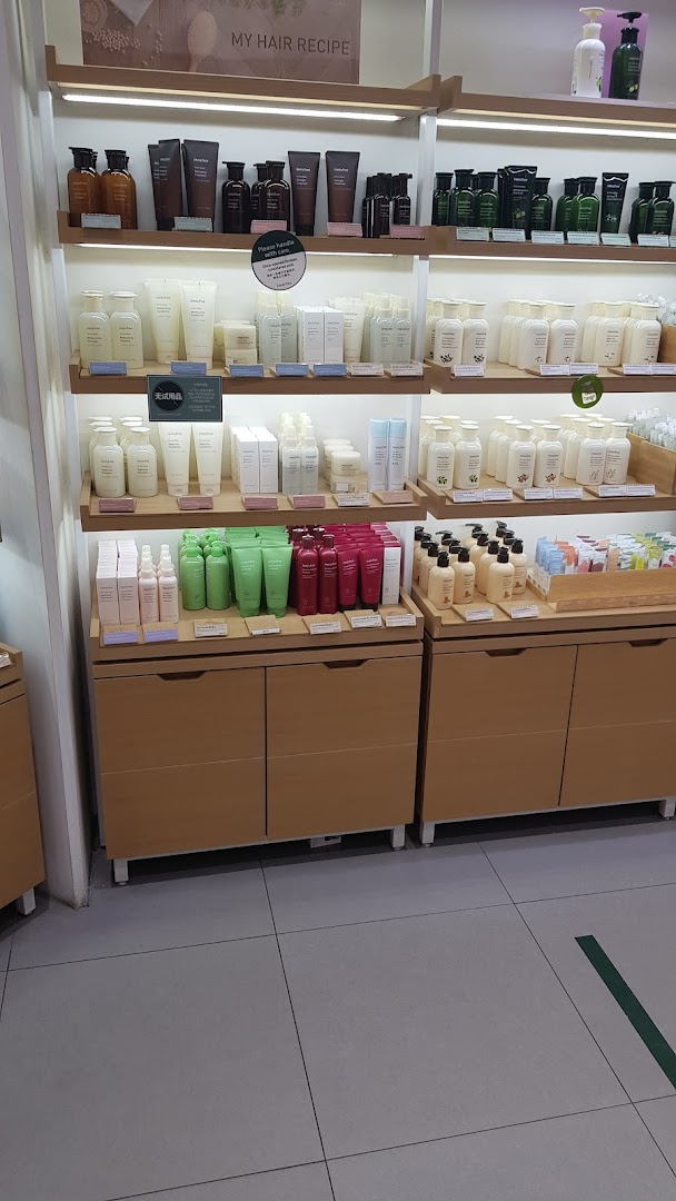 Innisfree shelves displaying a wide array of natural hair and body care products.