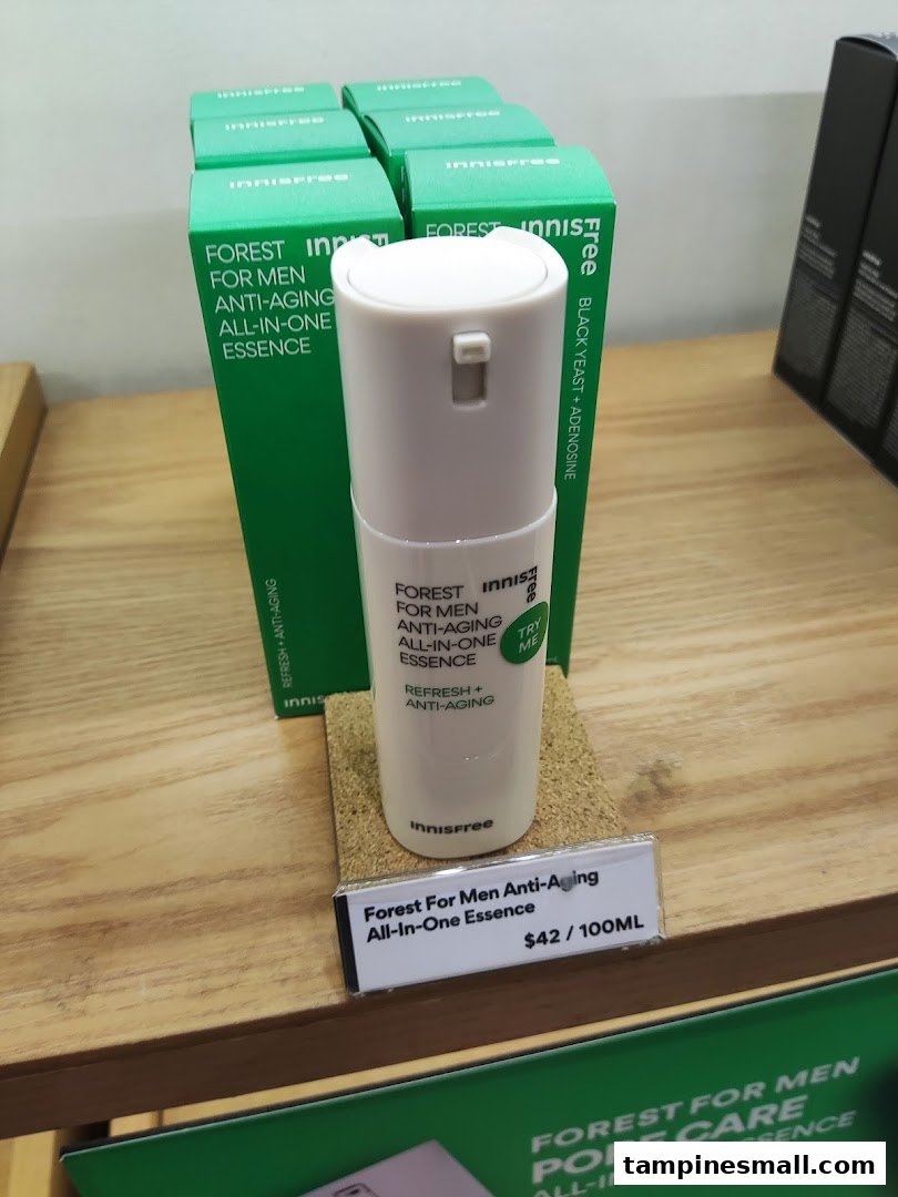 A display of Innisfree's Forest For Men Anti-Aging All-In-One Essence with product boxes and pricing.