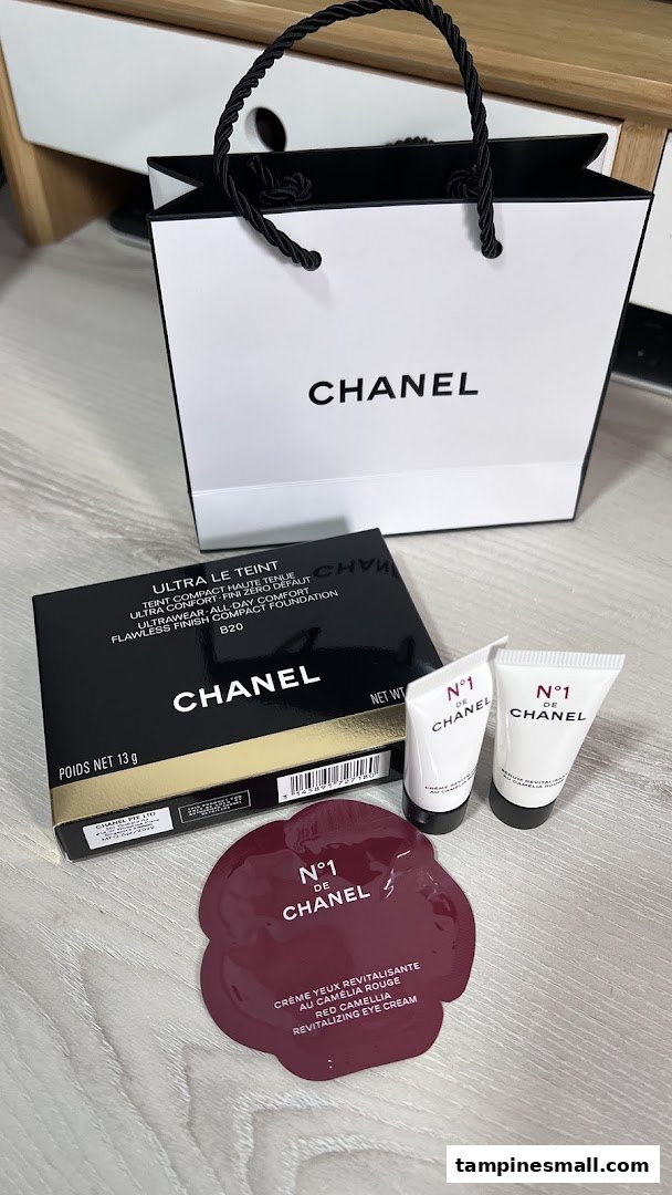 Chanel beauty products, including foundation and eye cream samples, with a shopping bag.