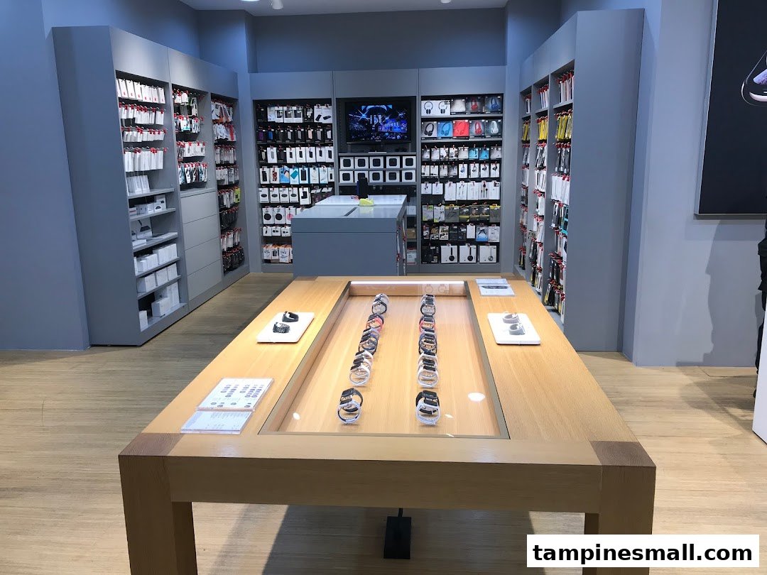 Interior view of iStudio, showcasing Apple Watches on display and shelves filled with accessories.