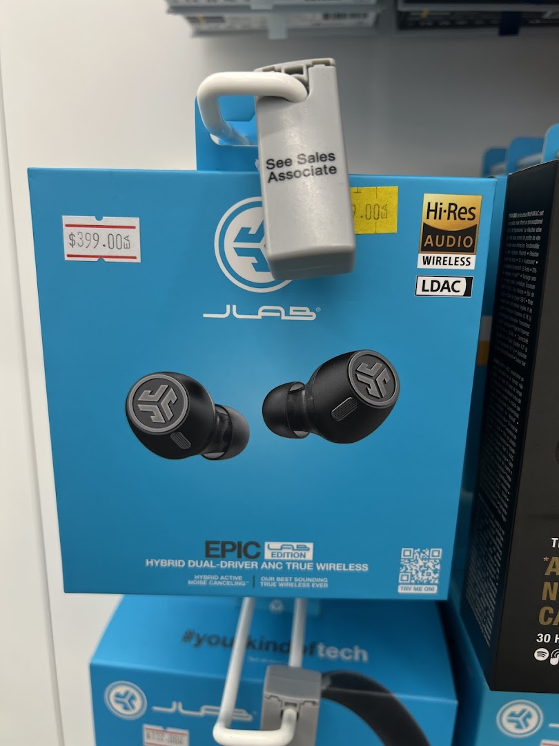 A JLab Epic Lab Edition earbuds box with price tag and security device on display.