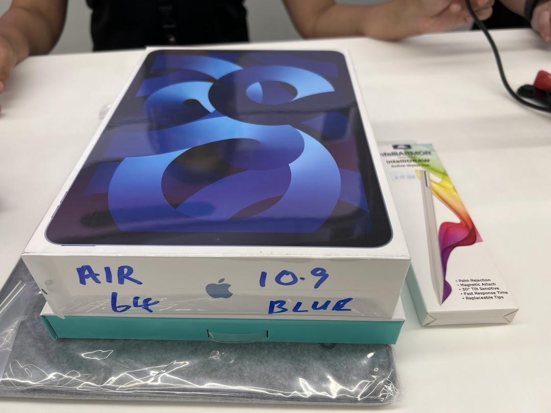 A new blue iPad Air box and an intelliARMOR stylus box on a white table.